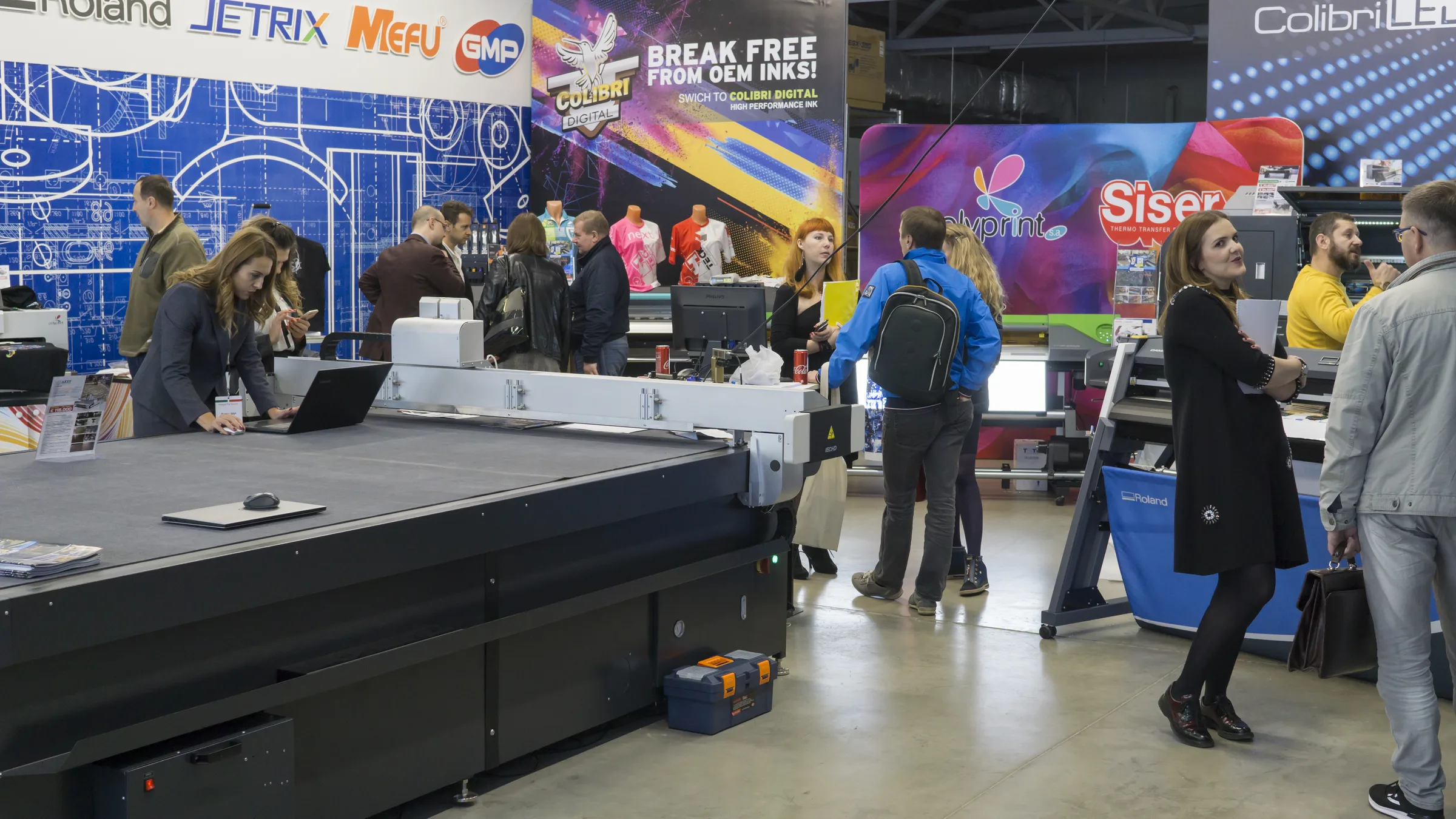 Printing and finishing equipment on display at an exhibition