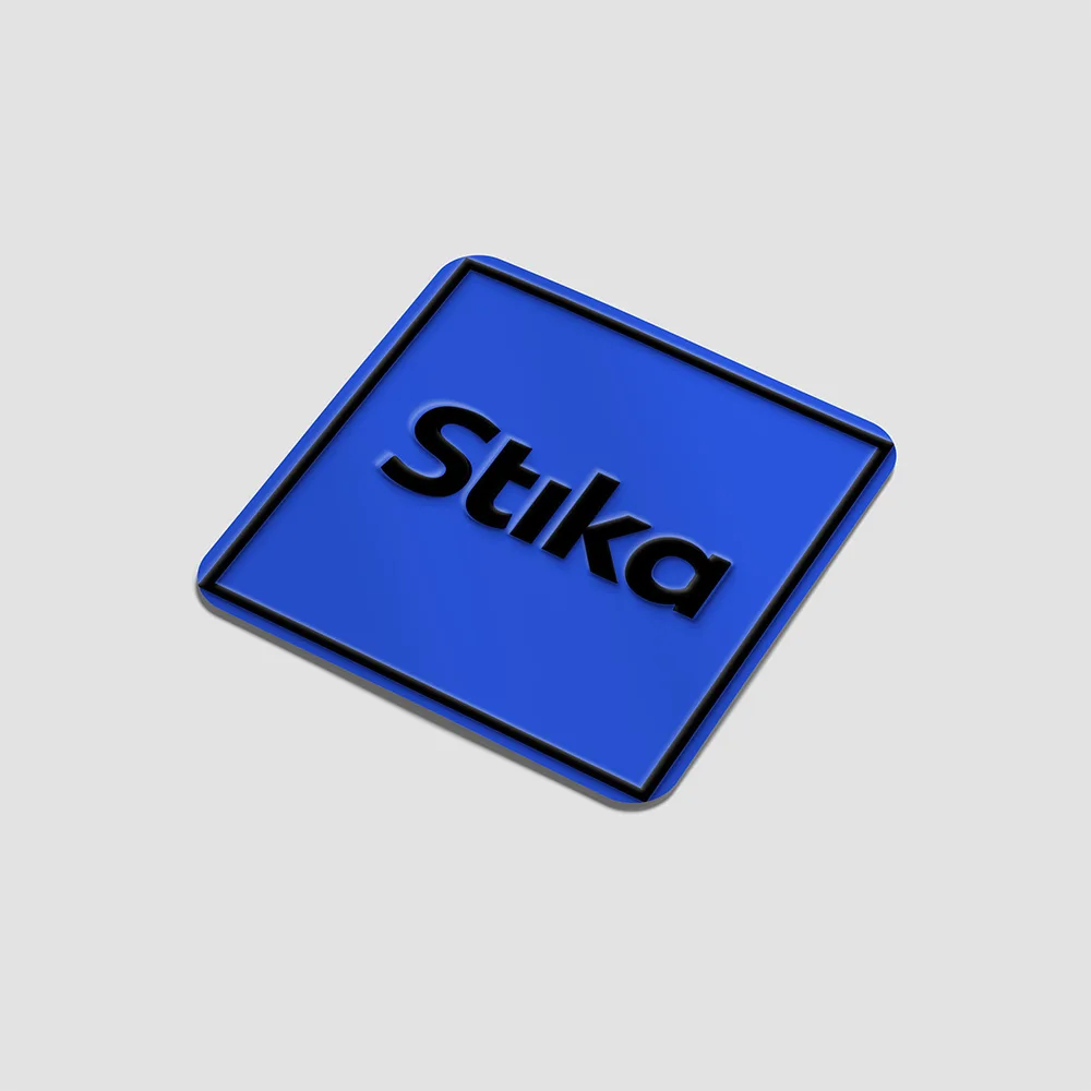 Illustration of a blue Stika sticker with raised black lettering